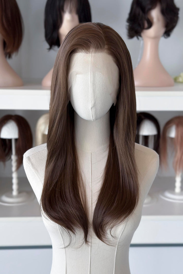 natural brown lace front wig display in a wig shop.