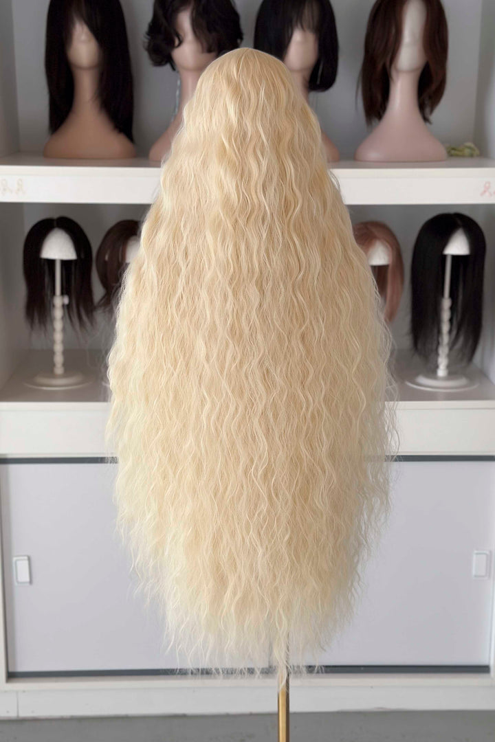Back and front view of 40 inch extra long icy platinum blonde wavy wig with bangs on a mannequin.