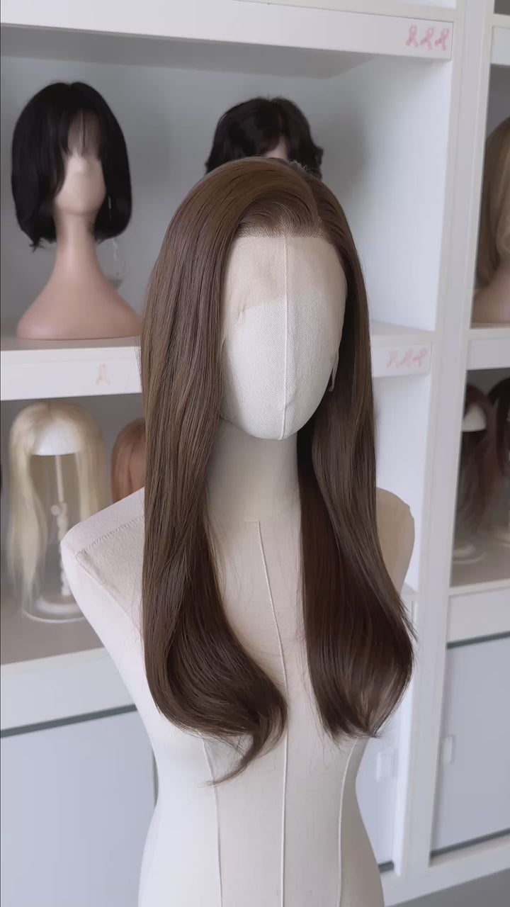 natural brown lace front wig display in a wig shop.