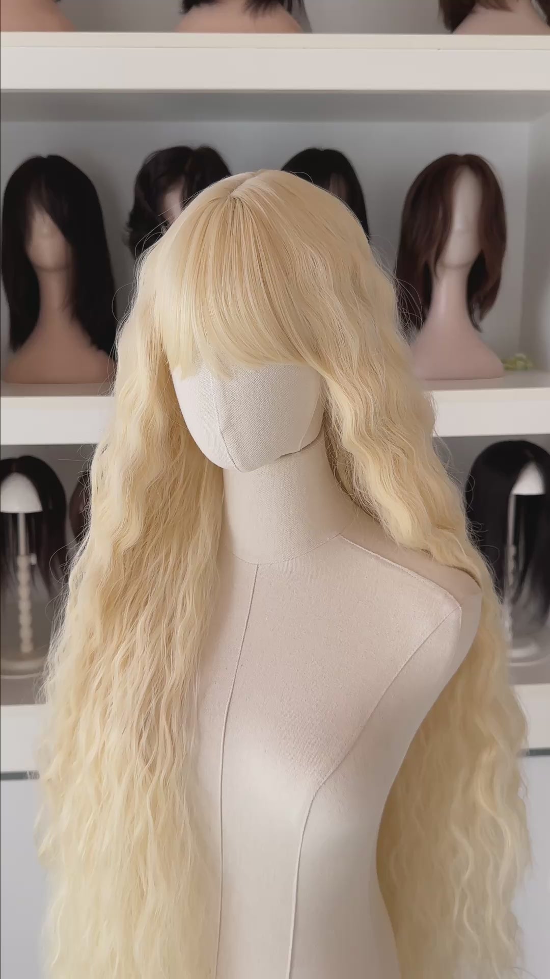 Back and front view of 40 inch extra long icy platinum blonde wavy wig with bangs on a mannequin.