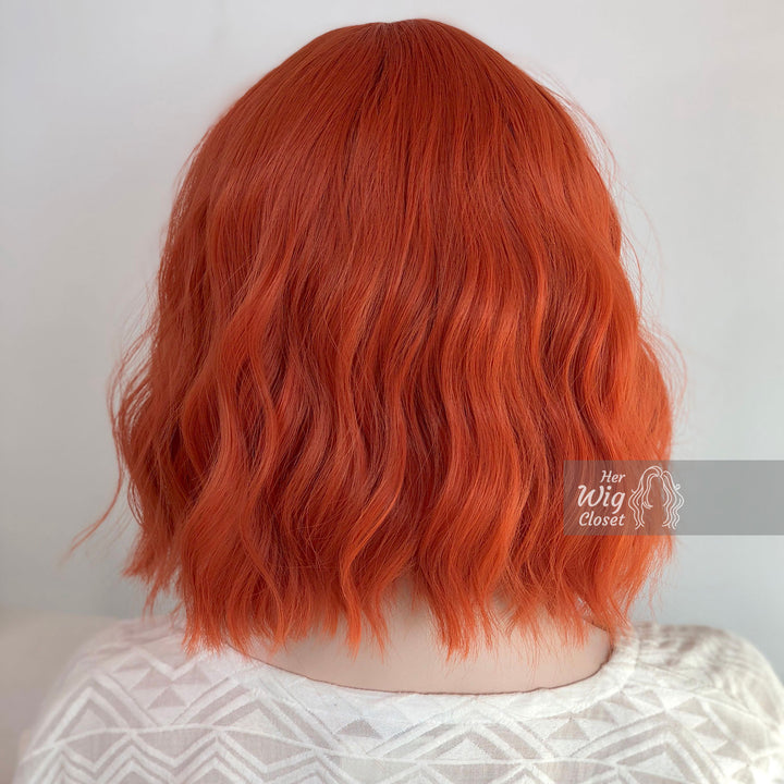 Lola | 12" Orange Wavy Bob Synthetic Wig with Bangs Her Wig Closet